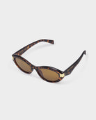 katie loxton Sunglasses with tortoiseshell frame and brown lenses on a white background
