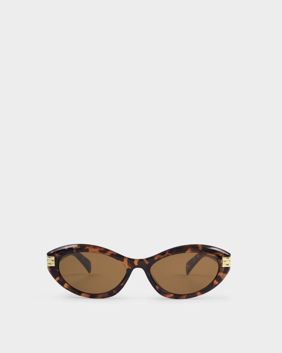 katie loxton Sunglasses with tortoiseshell frame and brown lenses on a white background