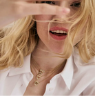 Close-up of a woman wearing the Soffio A'more collection from Nomination Italy.