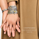Image showing close up of interlocking hands wearing multiple composable Nomination Italy bracelets 