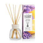 Yankee Candle Lemon Lavender reed diffuser bottle with natural reed sticks next to its retail box, on a clean white background.