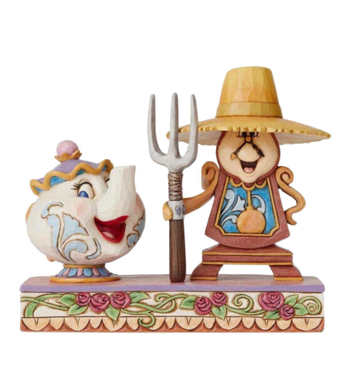 Two animated beauty and the beast character figurines on a decorative base with floral elements.