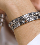 Close up image of nomination italy composable bracelets on a wrist