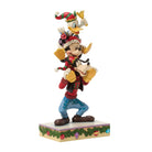 Animated Donald Duck, Mickey Mouse & Goofy character figurine with festive attire on a white background