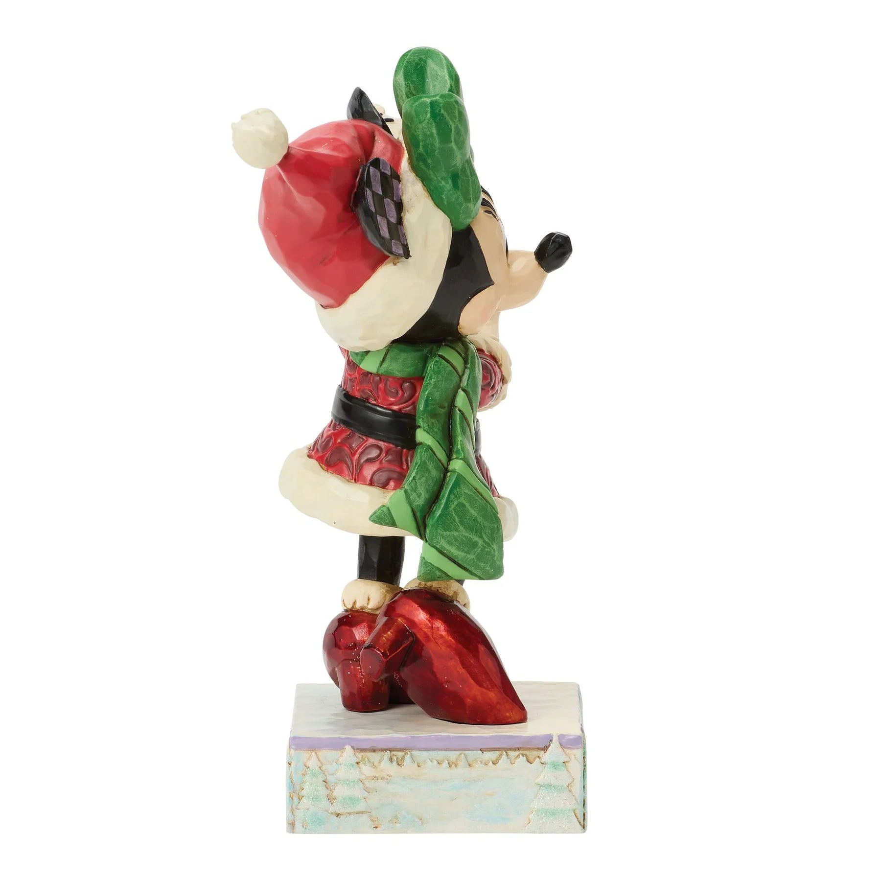 Minnie Mouse figurine with a red hat and green cape on a white background
