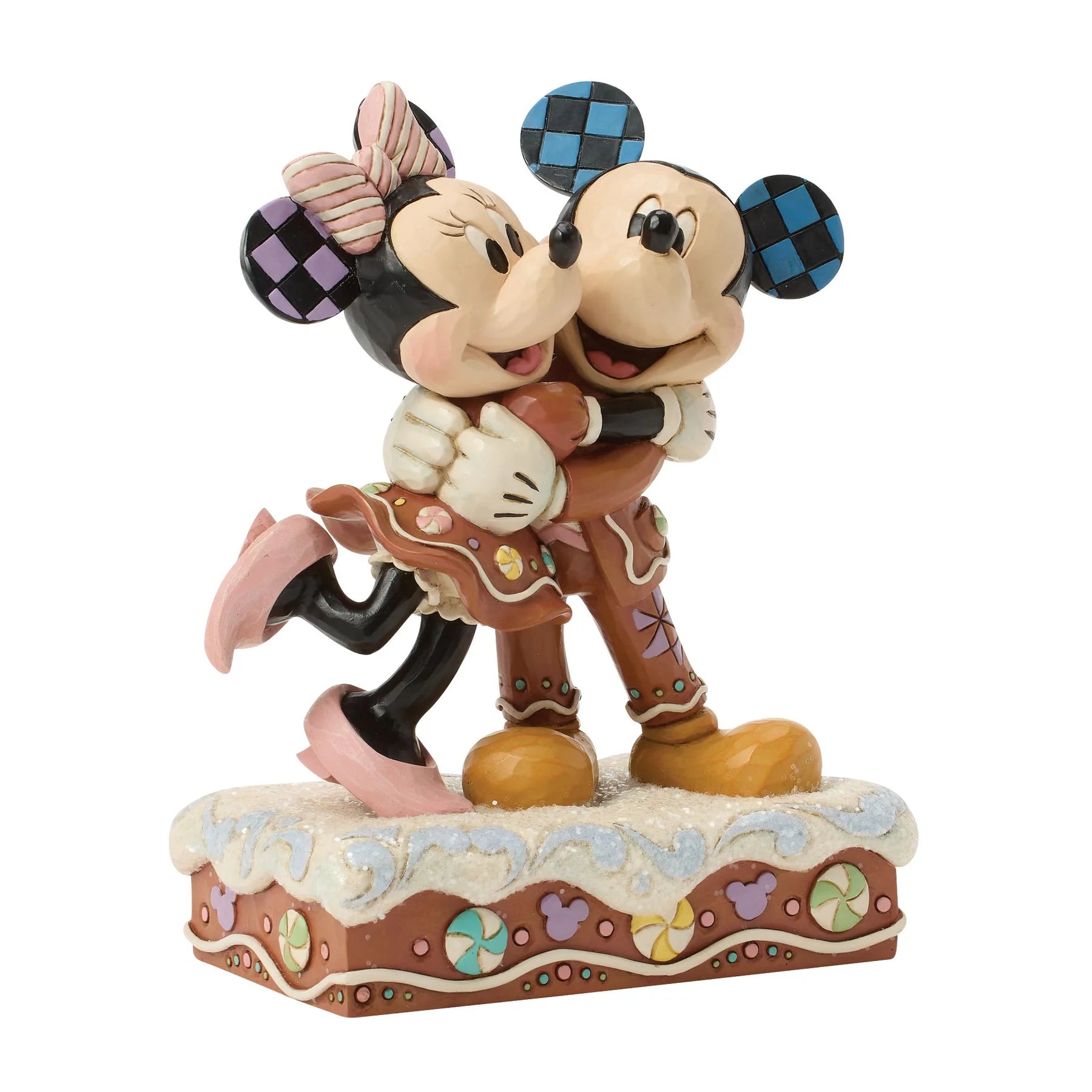 mickey & Minnie mouse in sugar coated outfits on a decorative base with a white background
