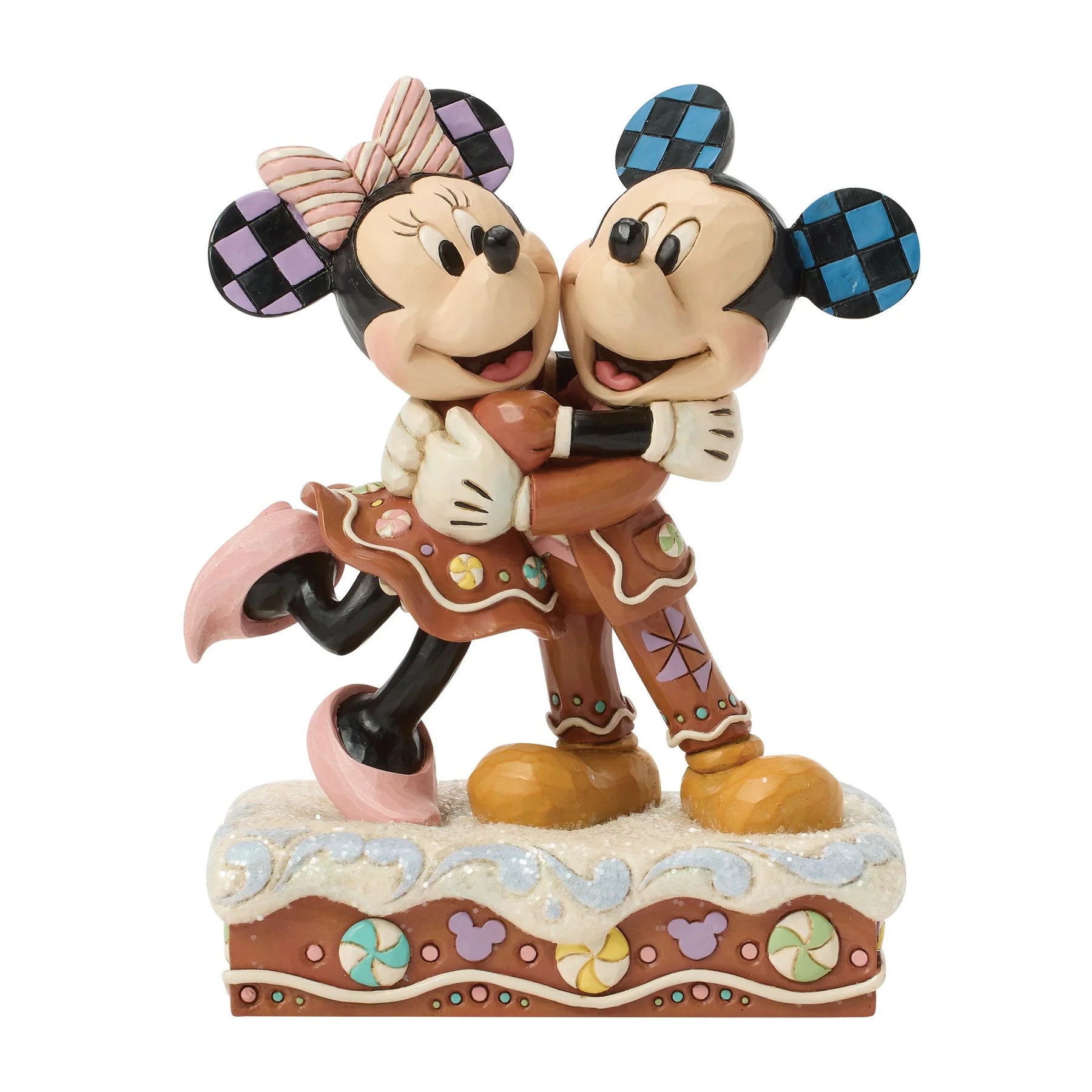 Statue of Mickey and Minnie Mouse hugging on a white background