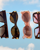 Sunglasses hanging on a string line for advertisement  
