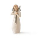 Willow tree friendship figurine of a woman holding a floral arrangement on a white background