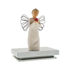willow tree Angel figurine holding a red heart on a white background